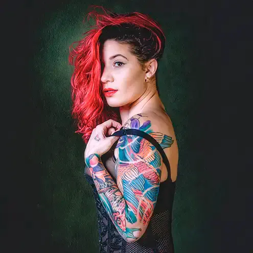 A redhaired girl with tattoos, portrait photograph