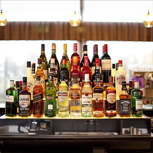 a commercial image showing bottles behind a bar