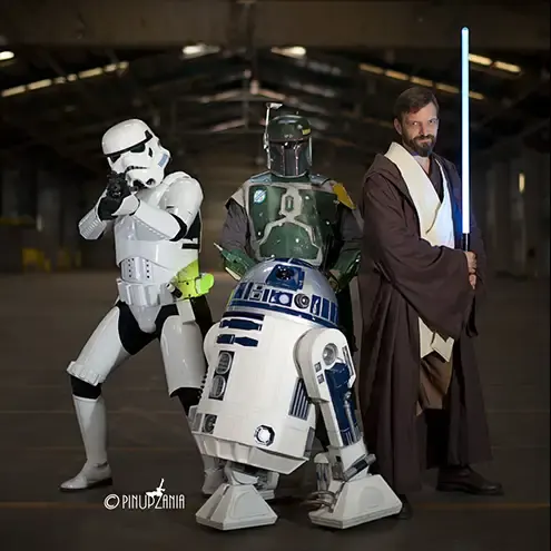 A group of star wars cosplayers in a large warehouse