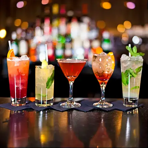 a selection of cocktails on a bar, food photography